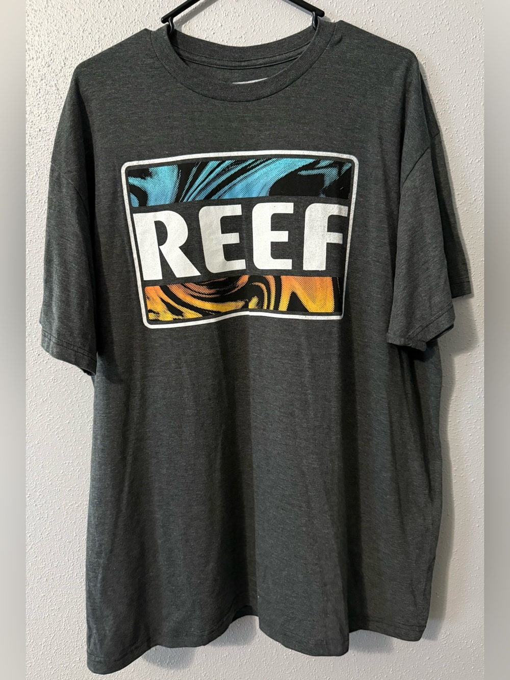 Reef Charcoal Logo Tee with Blue and Orange Graphic